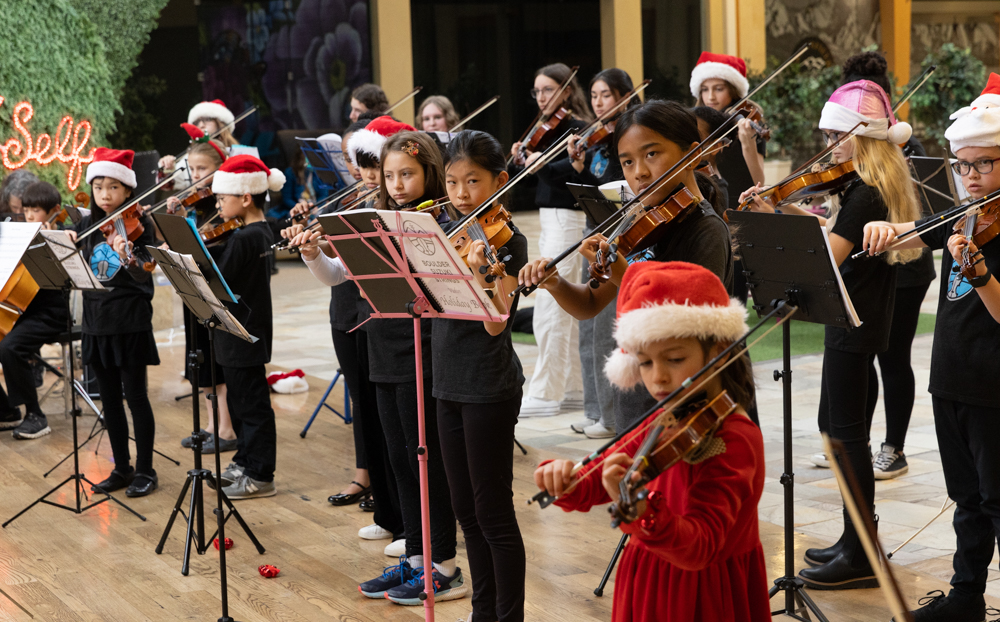 Boulder Suzuki Strings students performing holiday music at Flatirons Crossing Mall